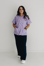 nurse wearing Chart My Heart printed scrub top by GET SCRUBBED