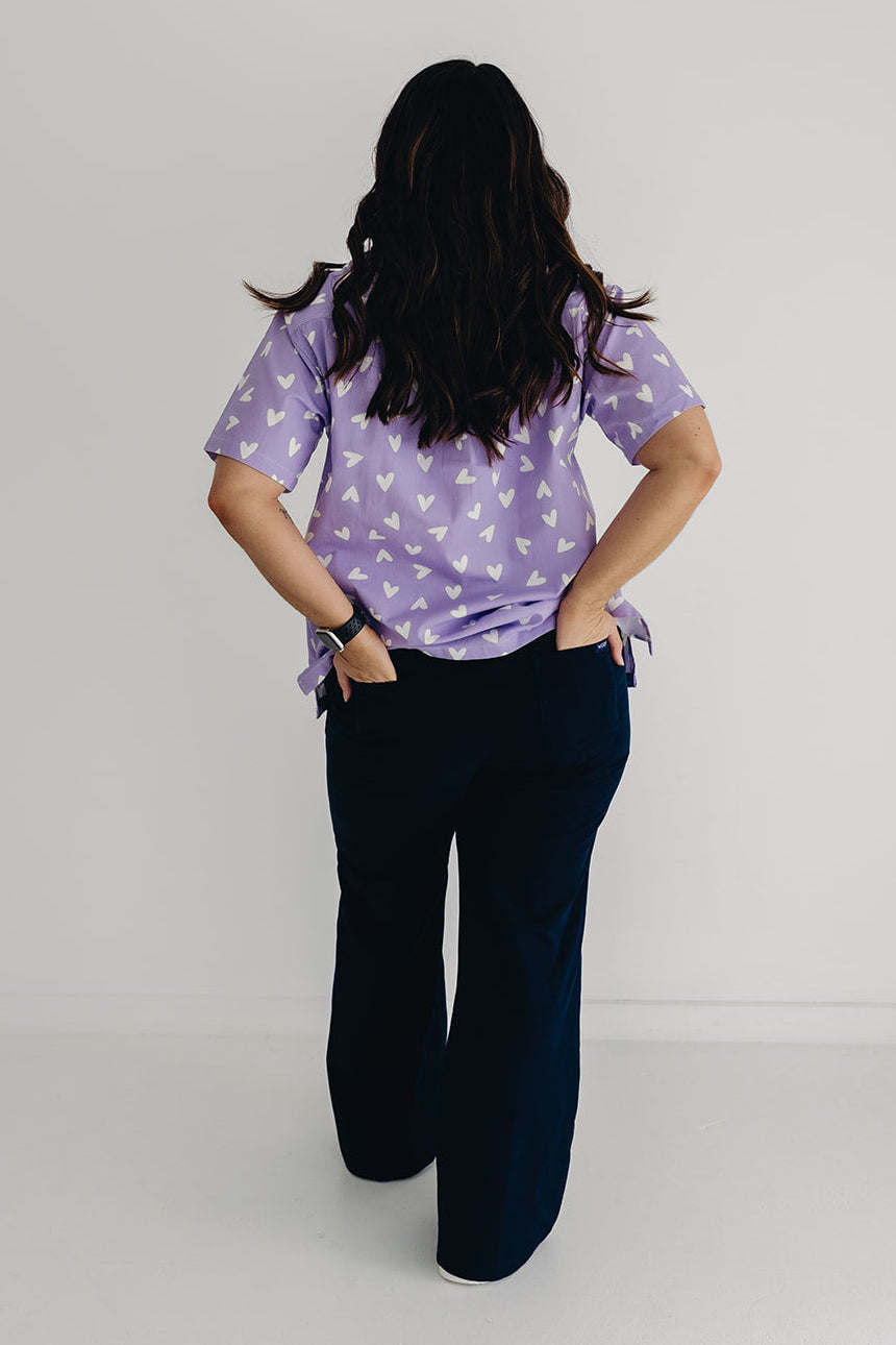 nurse wearing Chart My Heart printed scrub top by GET SCRUBBED